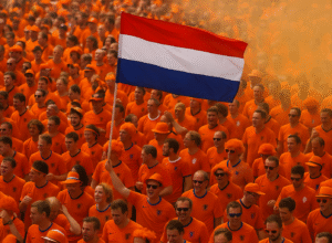 Dutch football culture on display as fans dressed in orange wave the national flag during a match celebration